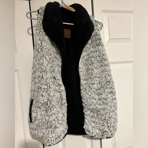 NWT. CC exclusive Sherpa vest. Reversible. Thick, warm and cozy. Size XS.